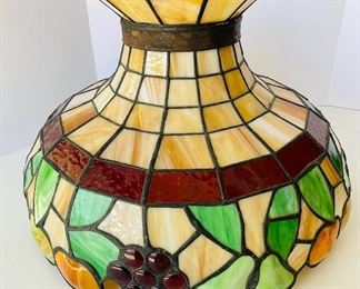 19/  Tiffany glass Tuscan style grape and pear stain glass shade • 21” x 14” with crest • $80