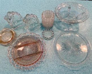 45/  Depression Glass Lot • pair of horse head book ends • set of coasters • divided relish server • nut bowl • large serving bowl • serving plate • sold as lot •	$42