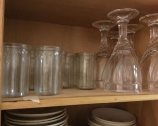 Set of 14 vintage small glasses on left - and 4 piece set of swirl stemmed glasses on right