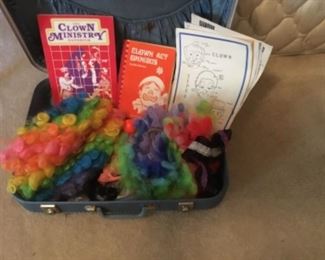 Clown items in vintage suitcase 
