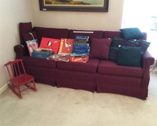 Living room - sofa, games, small child’s rocking chair