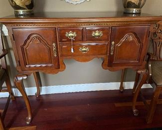 Tall leg credenza matches china hutch or stands alone.