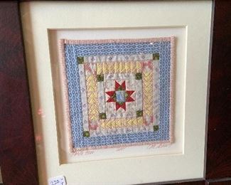 Miniature hand made quilt by Kate Adams.