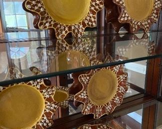 Unique set of vintage MacKenzie Childs plates with raised floral design.