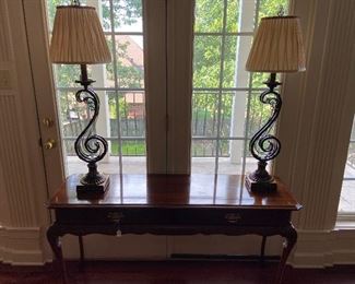 Sofa/foyer table with matching scroll base lamps.