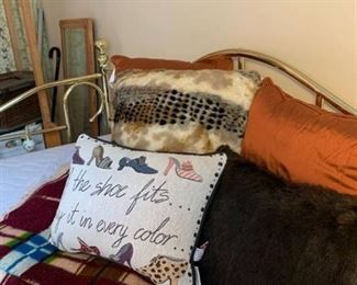 Lot of decorative throw pillows and wool blanket