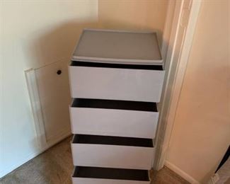 Five stackable plastic drawers for storage