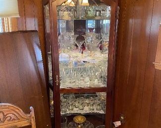 Curio cabinet filled with glassware
