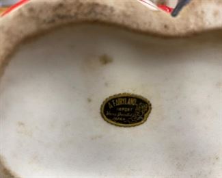 A. Fairyland Import Hand Painted Japan (bottom of clown planter)