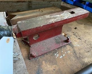 Railroad tie used as an anvil