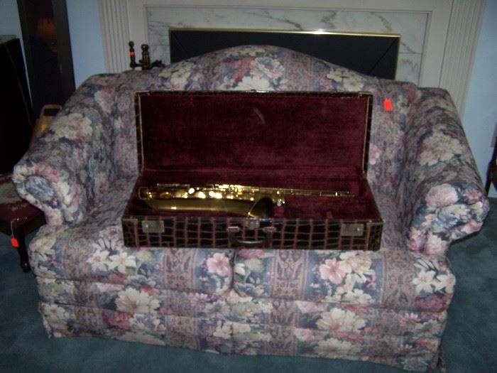 TENOR SAXOPHONE ("THE INDIANA" BY MARTIN OF ELKHART, INDIANA, SERIAL #71640)  & TWO-CUSHION LOVESEAT