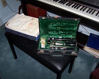 CLARINET & BOX OF VINTAGE BABY CLOTHING