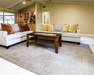 Ashley Furniture Bernat - Linen Sofa and Loveseat: Retail price $1050. Sale price here: $500. Deagan rectangular cocktail table, wood w/glass center: Retail $179. Sale price here: $80.