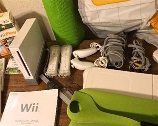 Wii gaming console with games, controllers, paddles