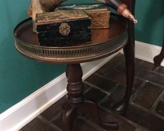 Small English butler’s table with antique horns and boxes 