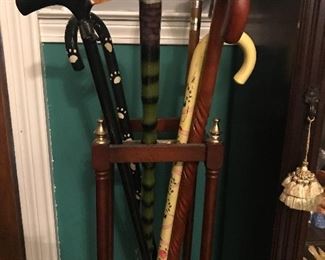 Canes from all over the world in vintage cane stand 