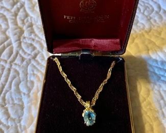 $450 18K gold chain and blue topaz pendant Chain 16", pendant 1/2" 