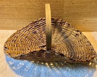$60 Vintage handled shallow woven basket.  Approx 16" H, 18" W, 15" D.
