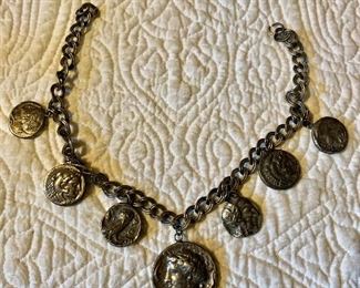 $25 Coin silver tone necklace 14" long, center coin 1 and 1/4" L 