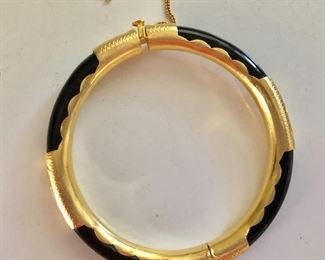 $45 Onyx and gold tone bangle bracelet, safety chain as is 