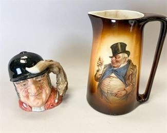 33	Pair of Ceramic Mugs	Warwick Ioga Dickens Jolly Man with Top Hat Ceramic Pitcher. Chips, 2 lines near top. Marked "IOGA WARWICK" on bottom. 10.5" H x 8" W. Royal Doulton "Gone Away" Character Jug, marked D6531.This piece was issued in 1960 - 82. Modeled by G. Sharpe. 7.25" H x 5" D. Fine condition.
