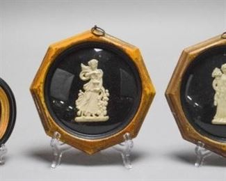 35	Trio of Ceramic Cameos	A grouping of three allegorical figures of ceramic encased in circular and octagonal frames. Good condition with some damage to frames. Glass and figures are still intact. Largest one measures 7.5" L x 7.5" W x 1" H.
