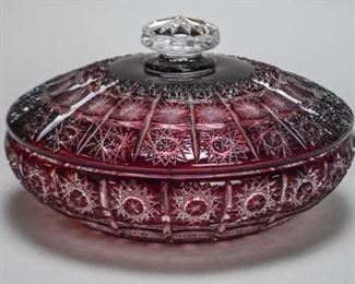 34	Bohemian Hand Cut Burgundy Crystal Bowl	A Bohemian hand cut burgundy crystal bowl with lid, made by Caesar Crystal Bohemiae in the Czech Republic. Bowl is over 24 percent lead crystal. Comes with original box. 6.5" H x 10.5" D. Box measures 12" L x 12" W x 6.5" H.
