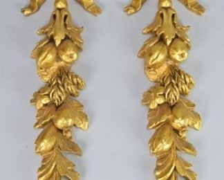 37	Pair of Gilded Carved Wood Ribbon Wall Hangings	Pair of Gilt Carved Wood Ribbon Wall Hangings, Ribbon, Fruit and Leaves 18 1/2" L X 5 1/2" W 1 1/2" D
