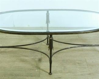 70	Oval Glass Coffee Table on Metal Base	Oval Glass Coffee Table on Metal Base. 50"L X 24" W X 17" H
