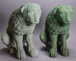 73	Pair of Green Terracotta Lion Sculptures	A pair of green-painted terracotta outdoor lion sculptures. One has a darker coat of paint than its partner, and has obvious crazing and some repair work done on its legs. Some chips and cracks present throughout both. Good condition. Each one measures approximately 14" L x 21.5" W x 22" H.
