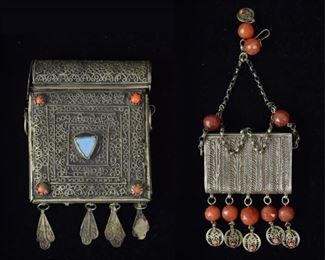 74	2 Mixed Metal & Stone Koran Cases	Silver tone case with coral and blue stones, 4 3/4"L; small silver tone case with coral and beads, 3"L. Larger case missing one metal decoration at bottom
