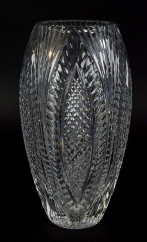 76	Waterford Flower Vase	A crystal flower vase by Waterford. Inscribed Waterford on its base. 13" H x 5" Diameter.

