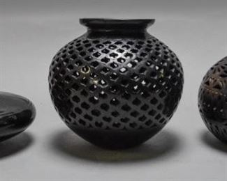 80	Oaxaca Art Pottery	2 pieces of Oaxaca pottery, 2 vases with carved geometric and crosshatch designs. With a squat porcelain flower pot, artist initialed CB. Good condition, some wear consistent with age. Largest item: 8" H x 8 1/2" diameter
