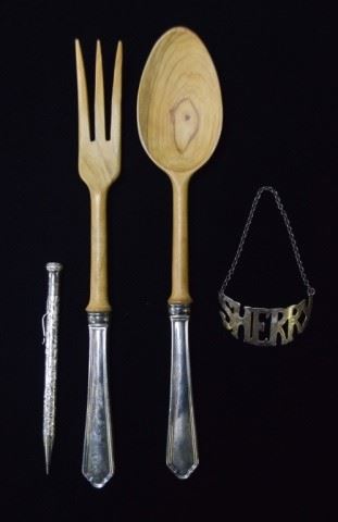 113	Sterling Silver Grouping	Wooden salad set with Webster Co. weighted sterling handles, sterling sherry decanter label, Wahl Eversharp sterling mechanical pencil. Pencil 5 1/2"L, 20 grams; sherry label 2 3/4"L, 10.9 grams.
