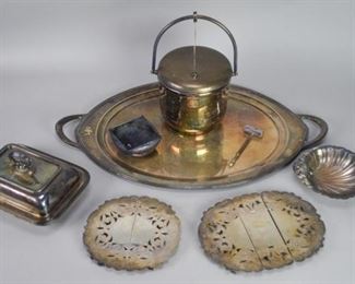 114	Lot of Silver Plate	Lot of Silver Plate, consisting of 1 Art Deco Silver Plate, Ice Bucket, with Handle that Opens Lid and Porcelain Insert for Ice, 1 Silver Plate Shell Dish, 1 Lidded Serving Dish, 1 Ice Cracker, 1 Square Bowl, 1 Silver Plate Rectangular Footed Hot Plate - 10 3/4" L X 8 1/2" W, 1 Silver Plate Circular Footed Hot Plate - 8 1/4" Diameter , Both Marked E.P.N.S. L.B.S. Co (Lawrence B Smith) 22/23 Superfine 31/37 and 1 Oval Silver Plate Platter, with 2 Handles, Monogrammed with "S" on Left Side Pair Point Sheffield - 0117 - 24 - Made in USA Some Scratching to Platter Surface 12" T X 7 1/2" Diameter

