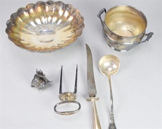 115	Lot of Silver Plate	Lot of Silver Plate, consisting of 1 Reed & Barton Soup Ladle, 1 Silver Plate Napkin Ring, 1 Silver Plate Weighted Knife, 1 Reed & Barton Bowl, 1 Silver Plate Meat Prong, and 1 Silver Plate Loving Cup with Handle
