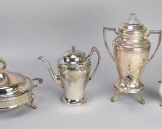 120	Silverplate Grouping	4 piece silverplate grouping including JW Robinson coffee pot, Continental urn with silverplate and glass lid, unmarked chocolate pot, covered vegetable with glass insert. Urn, 13 3/4"H
