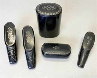 132	Grouping of Papier Mache Snuff Boxes	5 papier Mache snuff boxes. 3 shoes, 2 with paint decoration, 1 with mother of pearl inlays; oval box and cylindrical box, both with paint decoration. Some minor wear consistent with age. Cylindrical box 2"W x 3"H, largest shoe 3 1/2"L x 1 1/2"H
