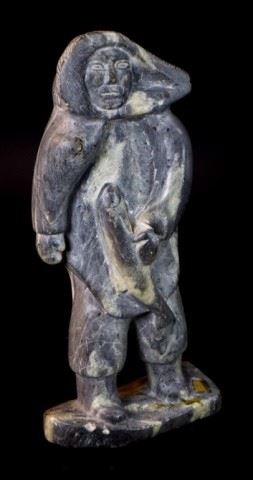 136	Inuit Stone Carving	Inuit stone carving man with fish. Unsigned. 12 1/2"H. Minor chips to base.
