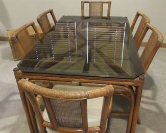 Vintage rattan dining room set with sofa table and side tables.