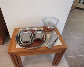 Danish modern teak nesting tables and mid-century stainless serving pieces