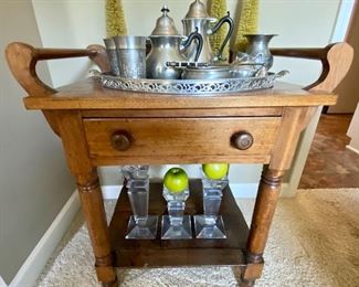 Antique one-drawer washstand with towel holder on each side, crystal candlesticks, assorted pewter.