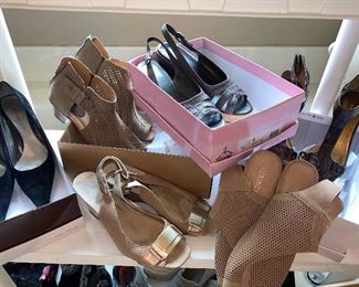 Assorted handbags, shoes, and boots.