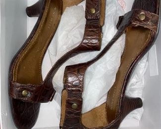 Assorted handbags, shoes, and boots.