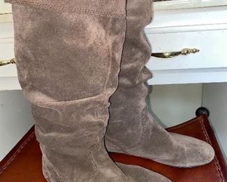 Assorted handbags, shoes, and boots.