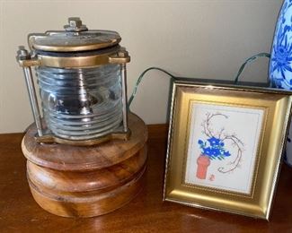 Fresnel lens light, with brass housing, mounted on wood—no plug.