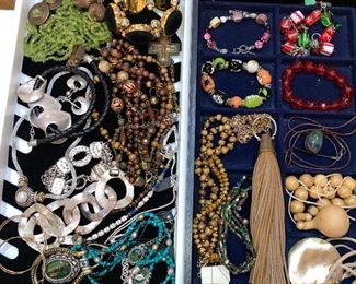 100’s of costume jewelry pieces, some new with tags.