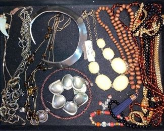 100’s of costume jewelry pieces, some new with tags.