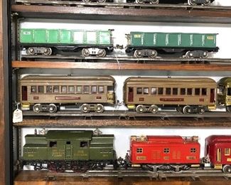 Large collection of Lionel prewar and a good number of Ives trains also, the custom display cases are for sale as well.
