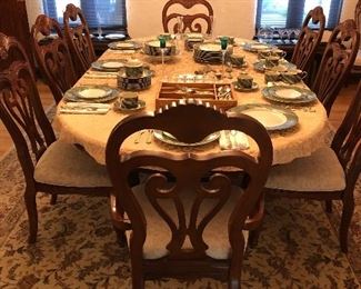 Mahogany dining room table and 10 chairs from Brewster & Stroud